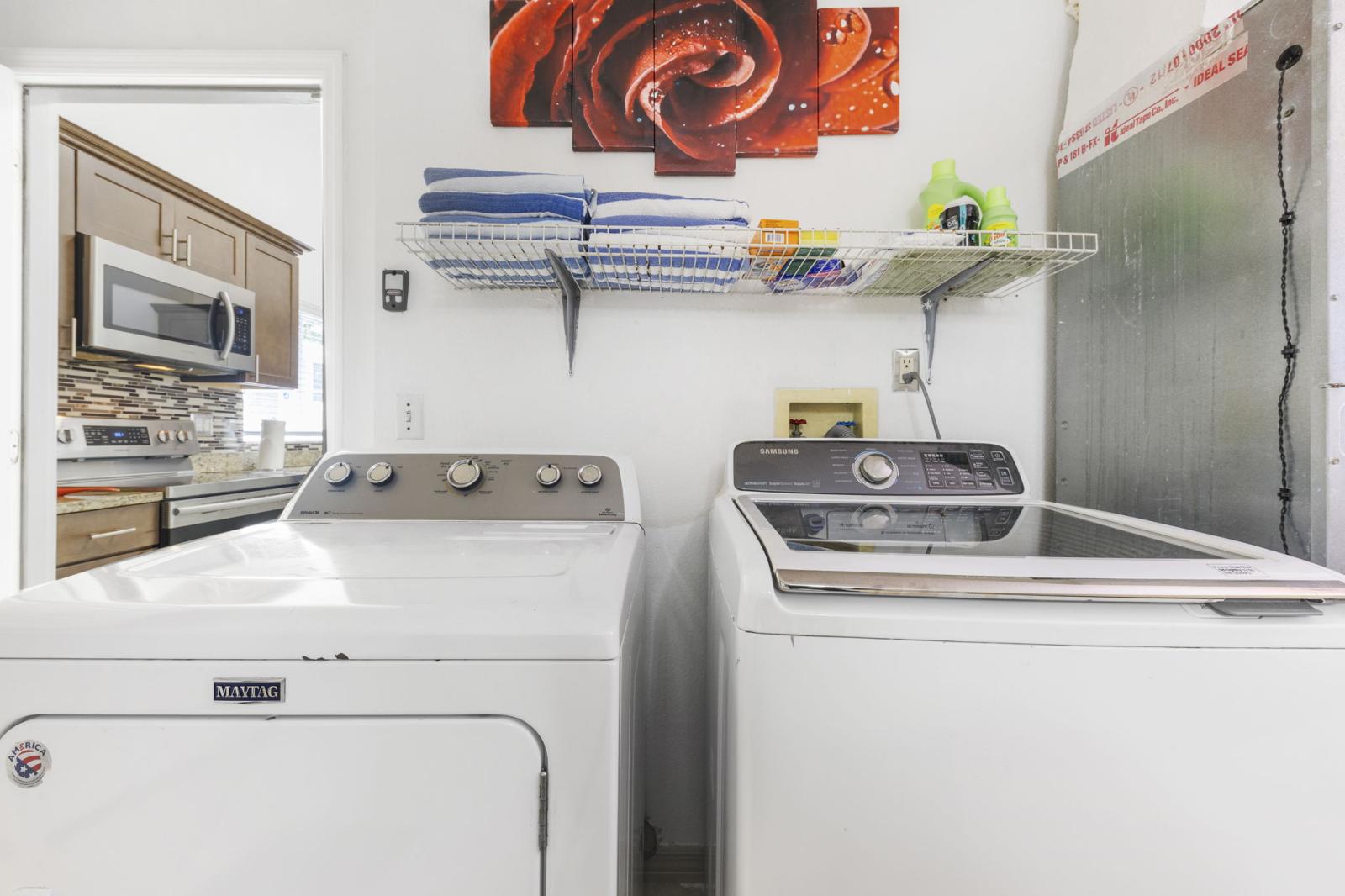 Convenient in-home laundry room featuring a Maytag dryer and Samsung washer—fully equipped and ready for extended stays or everyday ease.
