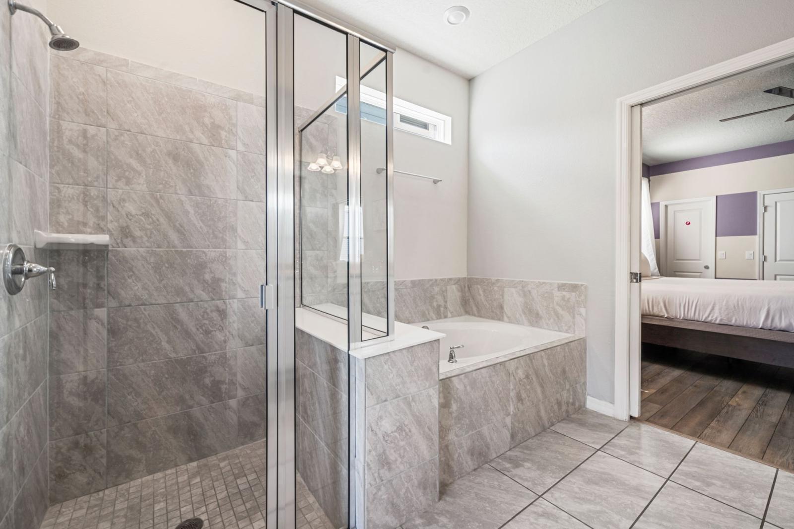 Bathroom 2 with a walk in shower and a bathtub