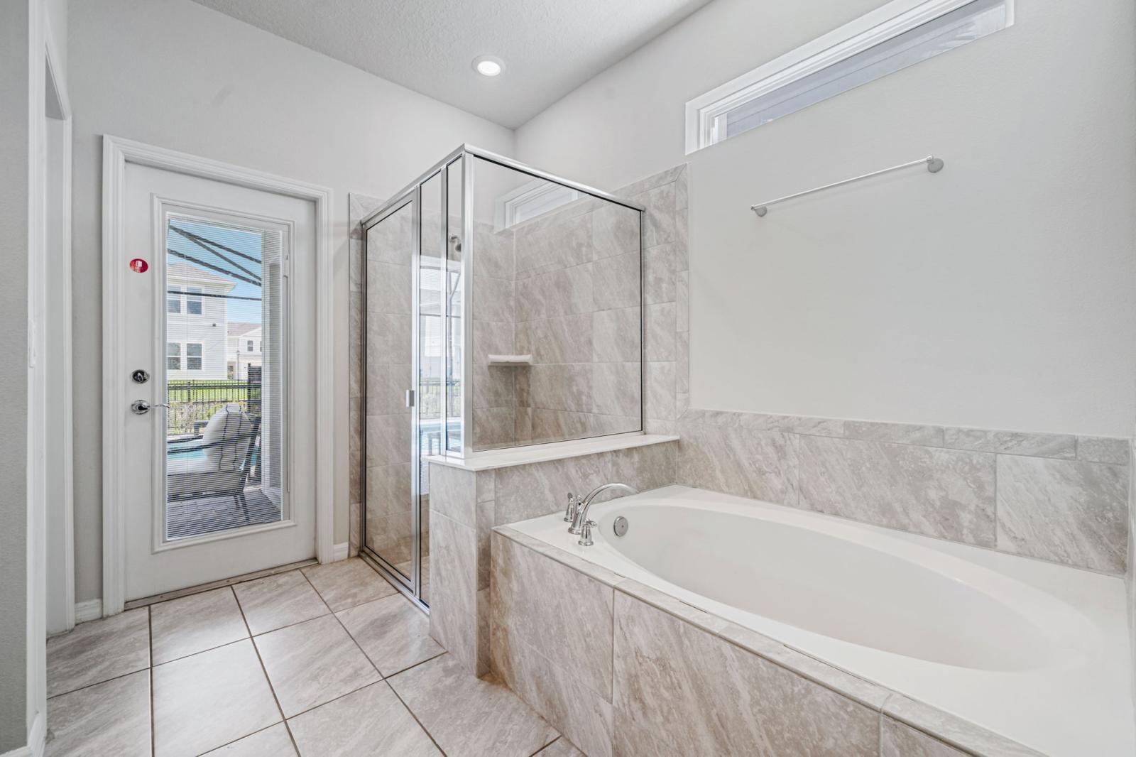 Bathroom 2 with a walk in shower and a bathtub