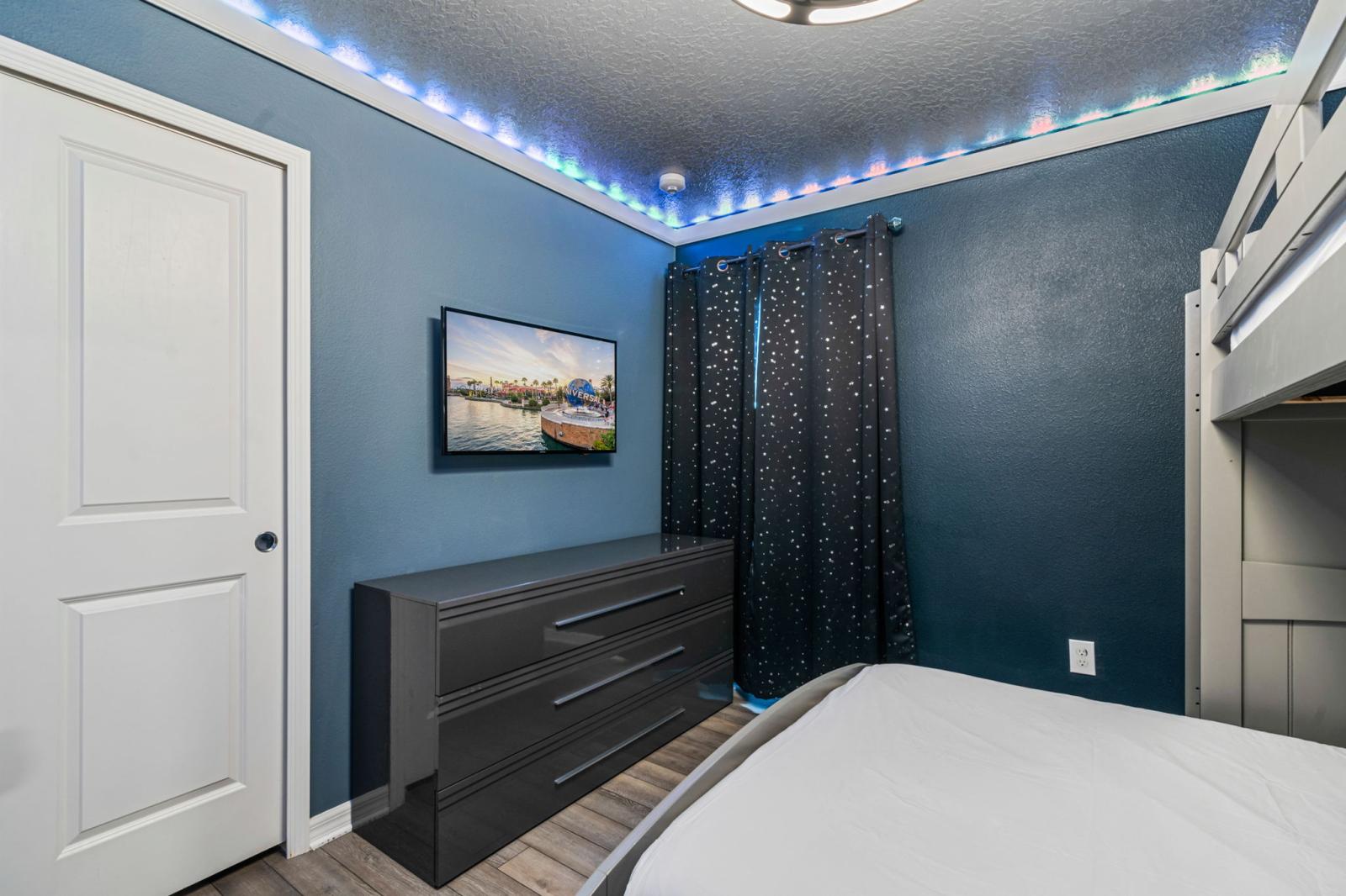 Bedroom 7 with a double bed and a single bed  and a Smart TV