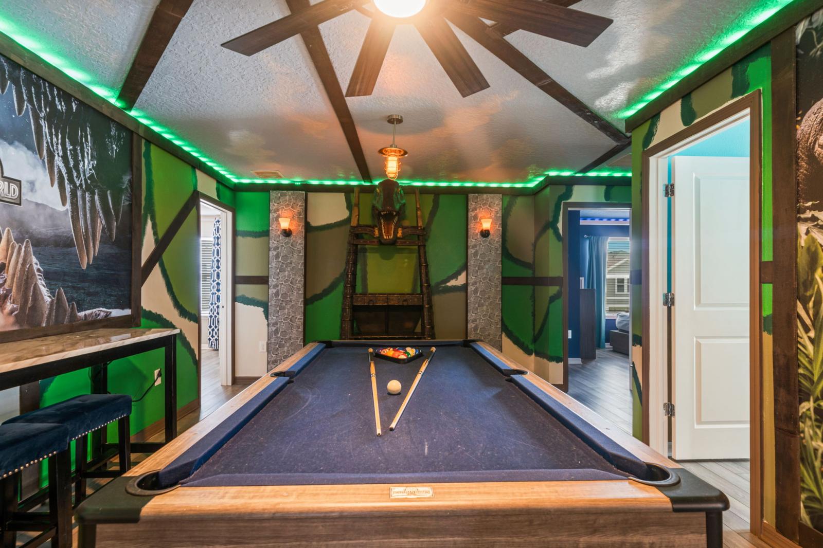 Loft area with a pool table and an arcade games