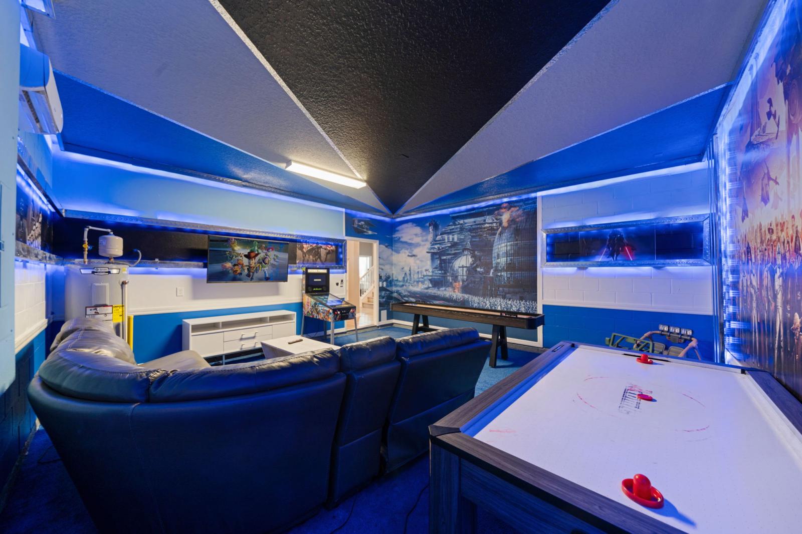Game room area with arcade games and air hockey table