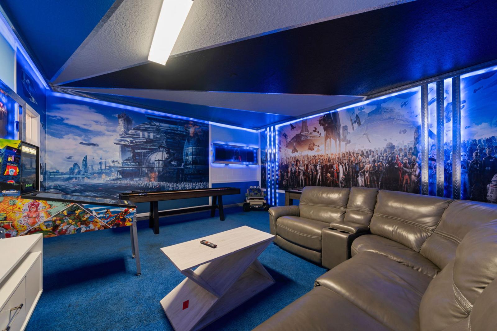 Game room area with arcade games and air hockey table