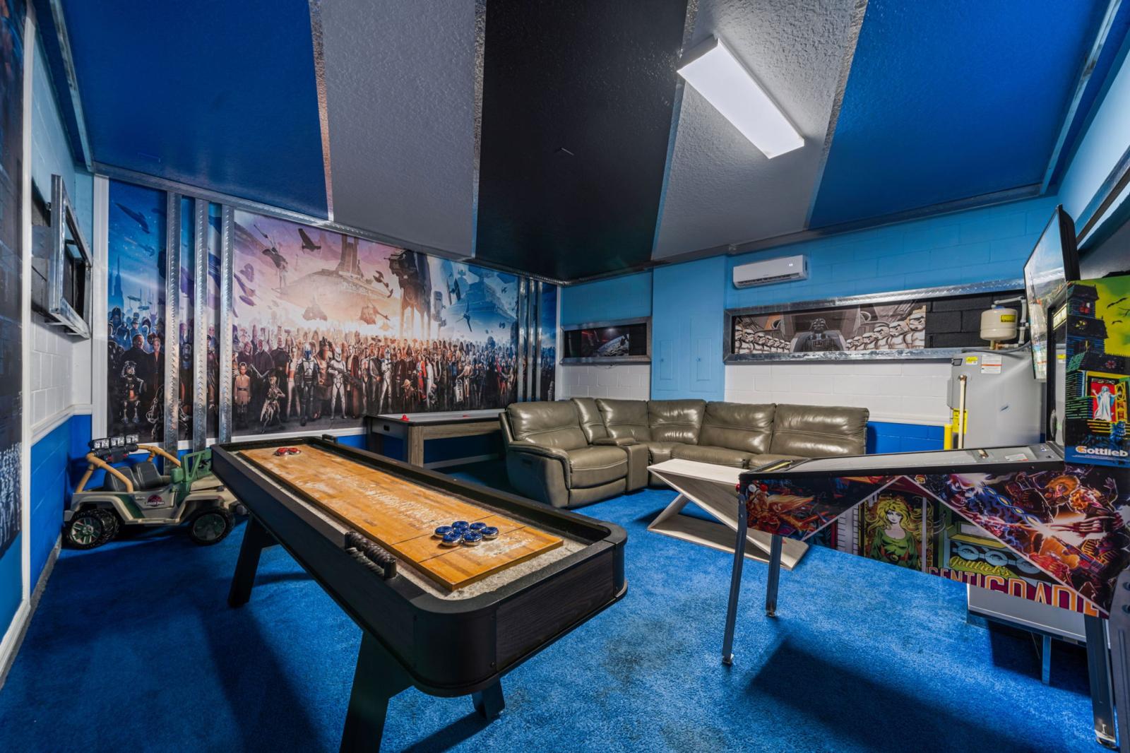 Game room area with arcade games and air hockey table