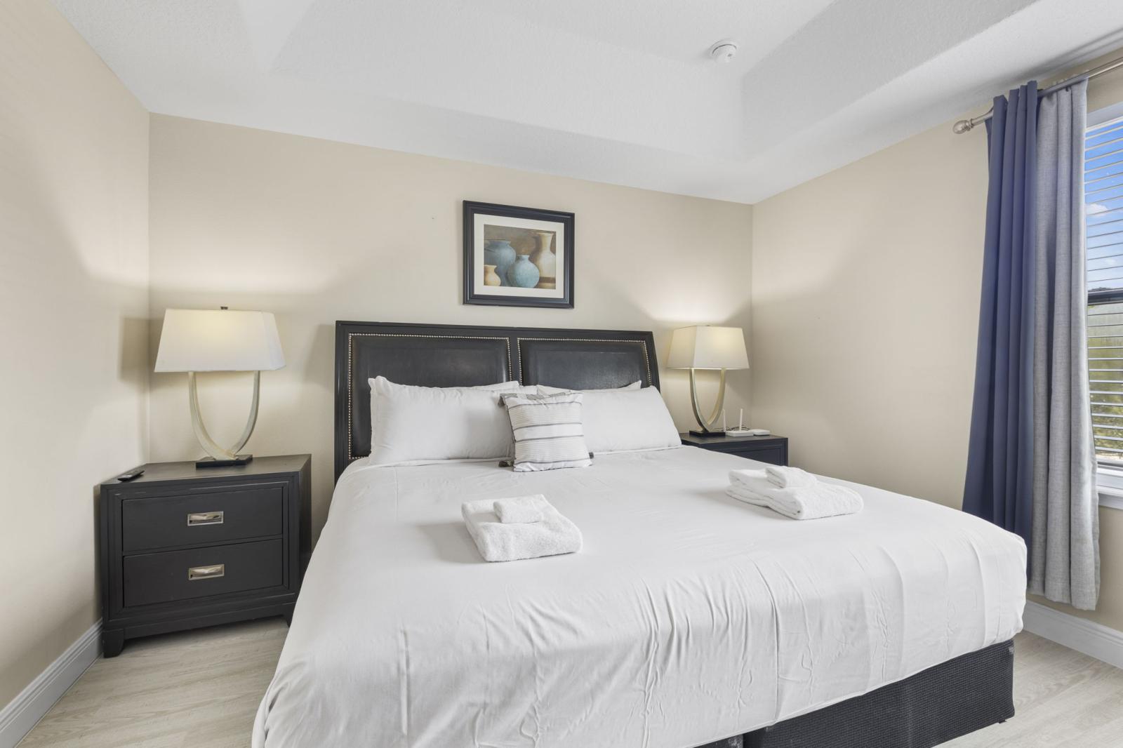 Serene primary suite with king-size bed, premium linens, and private ensuite bathroom for maximum comfort and privacy.
