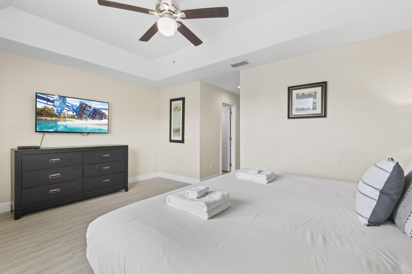 Serene primary suite with king-size bed, premium linens, and private ensuite bathroom for maximum comfort and privacy.