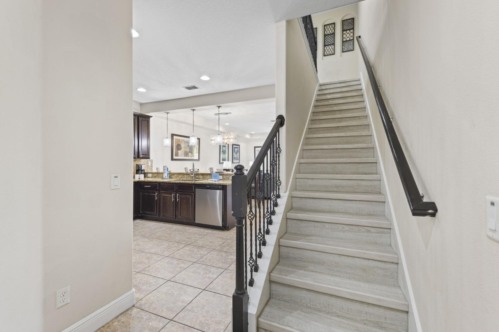 Elegant interior staircase leading to the second floor, where all bedrooms and additional bathrooms are located—offering privacy and a well-defined separation between living and sleeping areas.