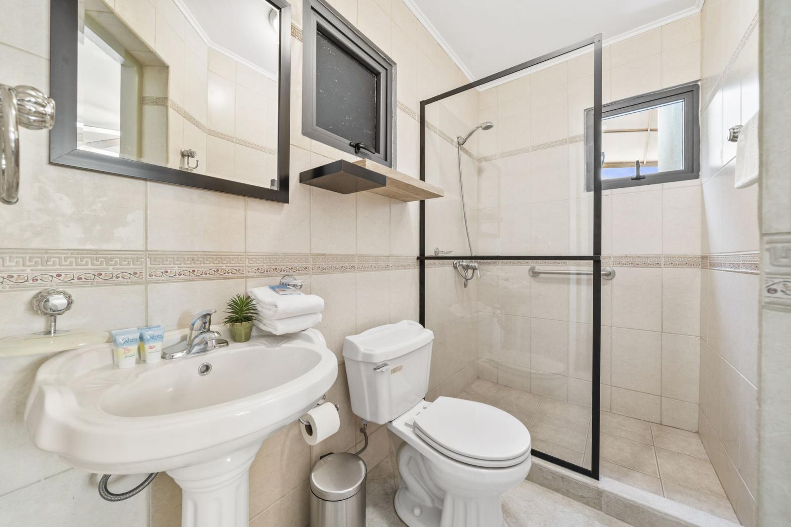 bathroom 2 offers a walk in shower
