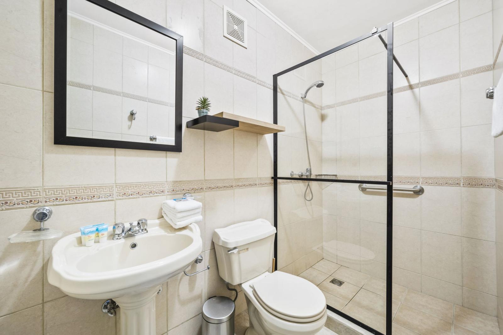 bathroom 3 offers a walk in shower