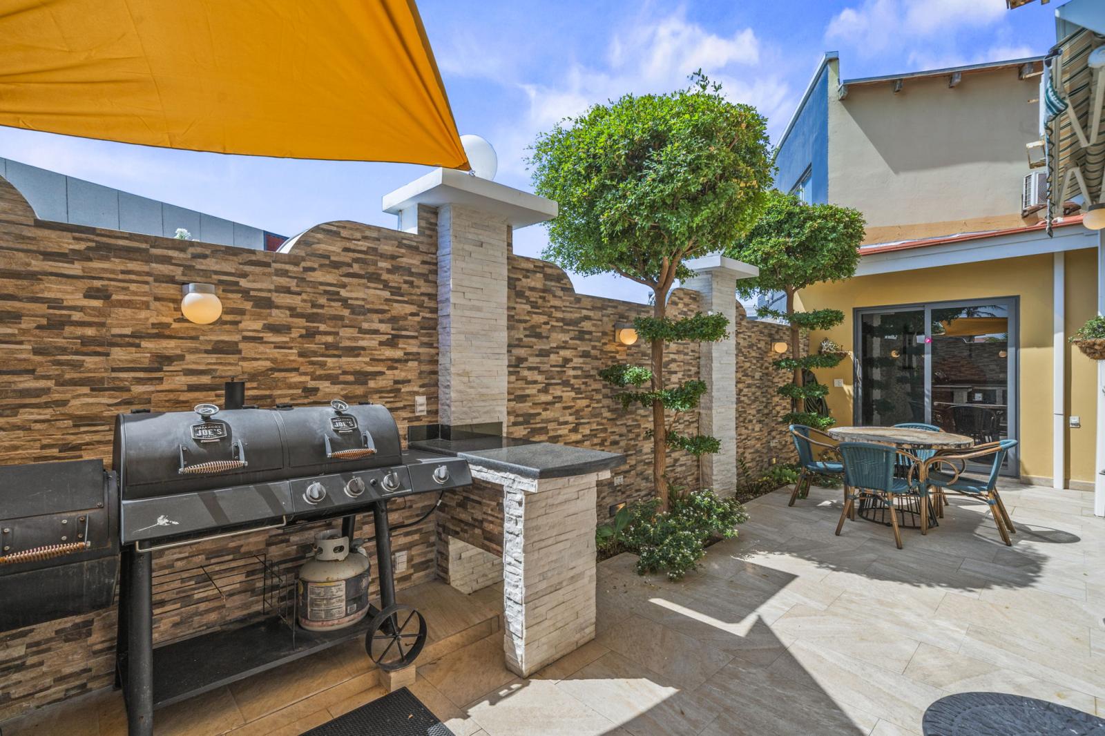 Outdoor dining table by the grill