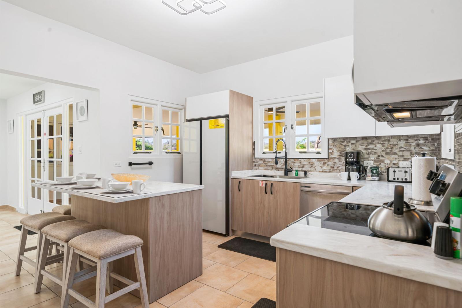 Kitchen is fully equipped with stainless steel appliances