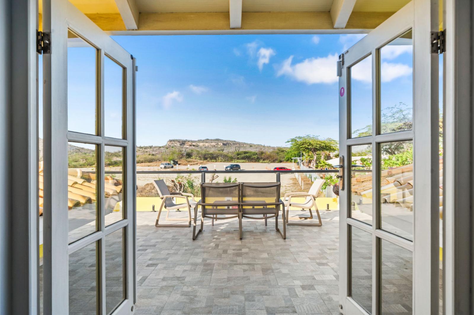 Rooftop on the second floor of the home with a pool view