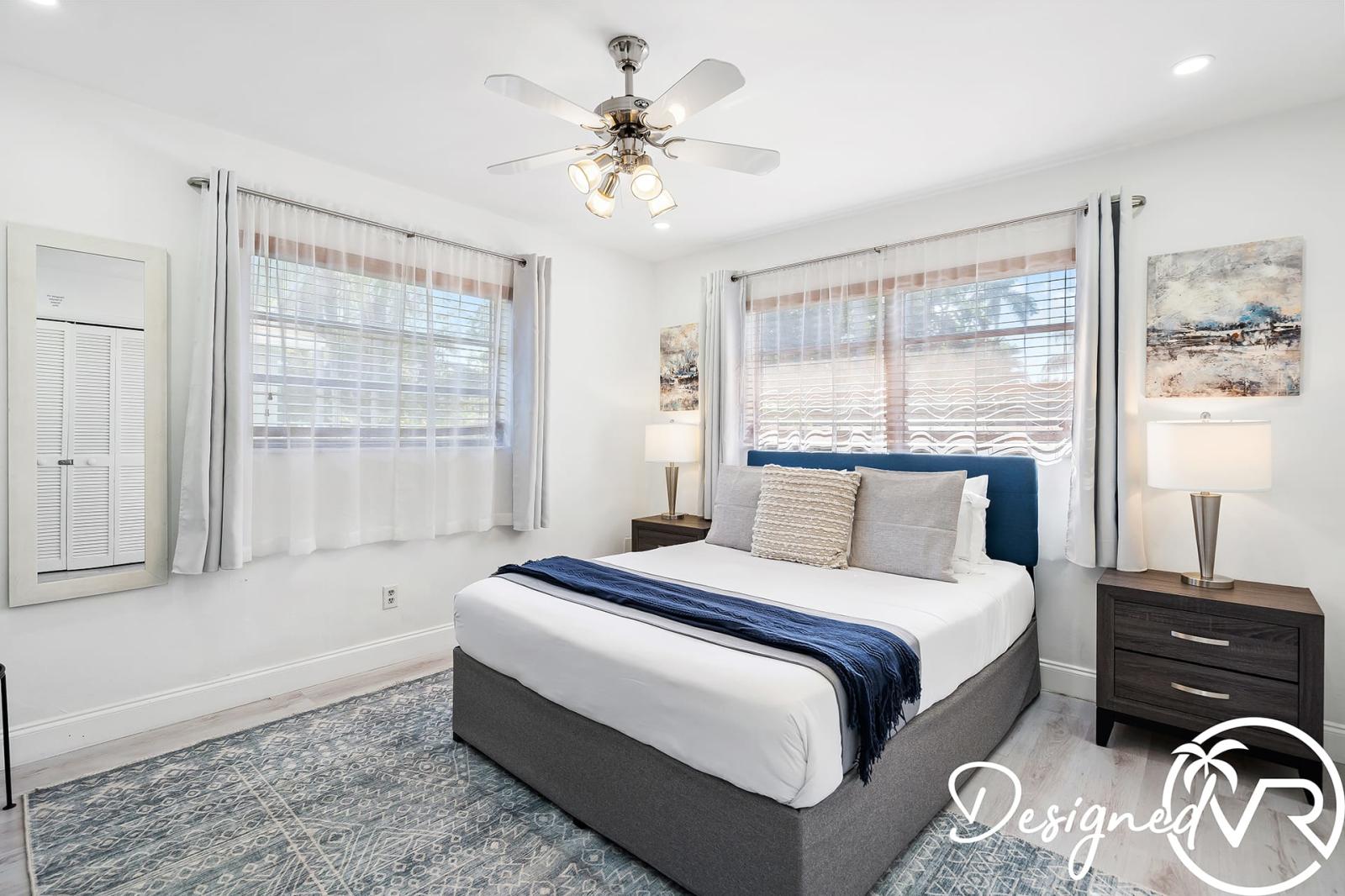 Master bedroom with king bed and attached bath