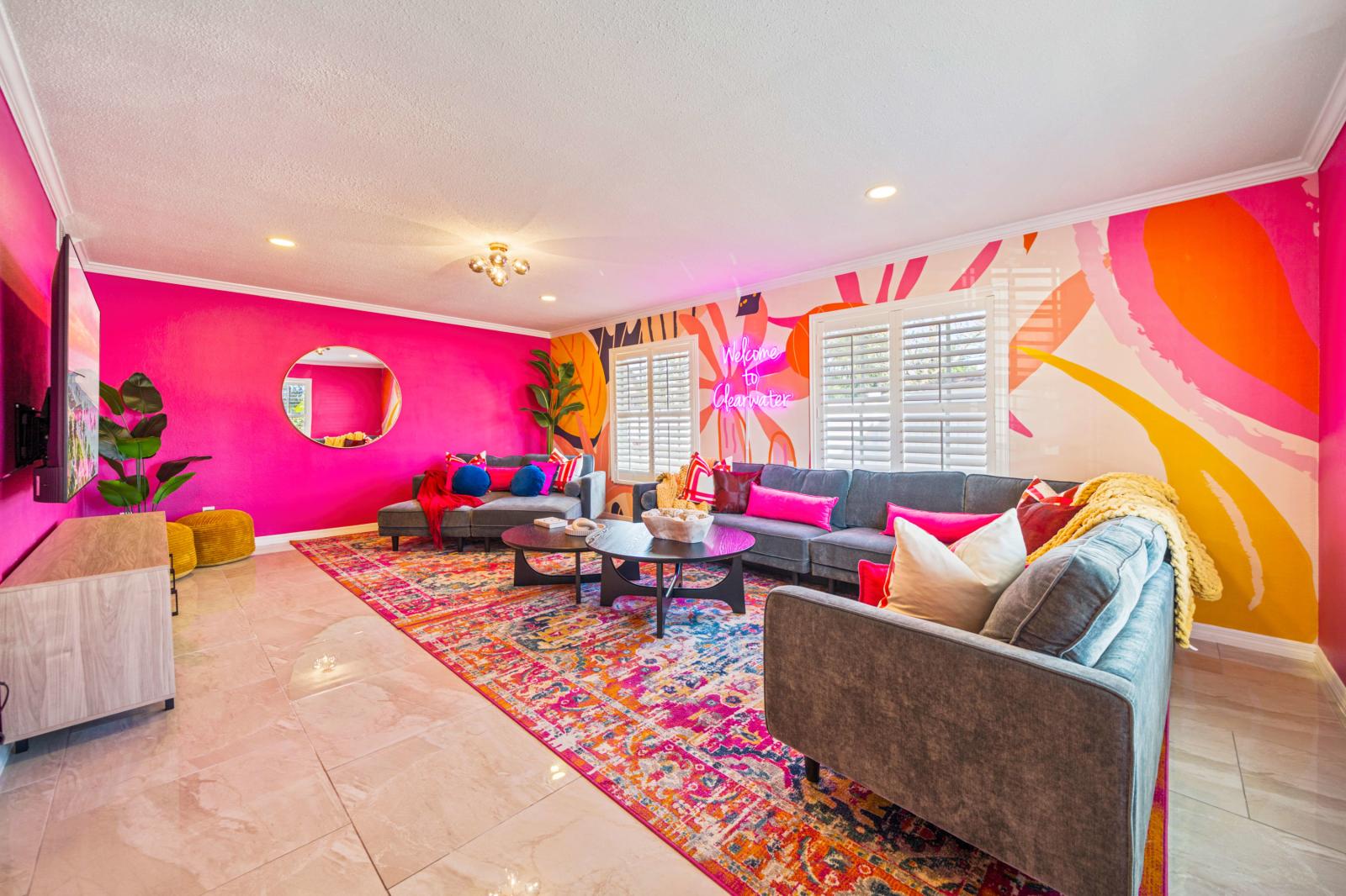 Living room with large 75" smart TV and board games