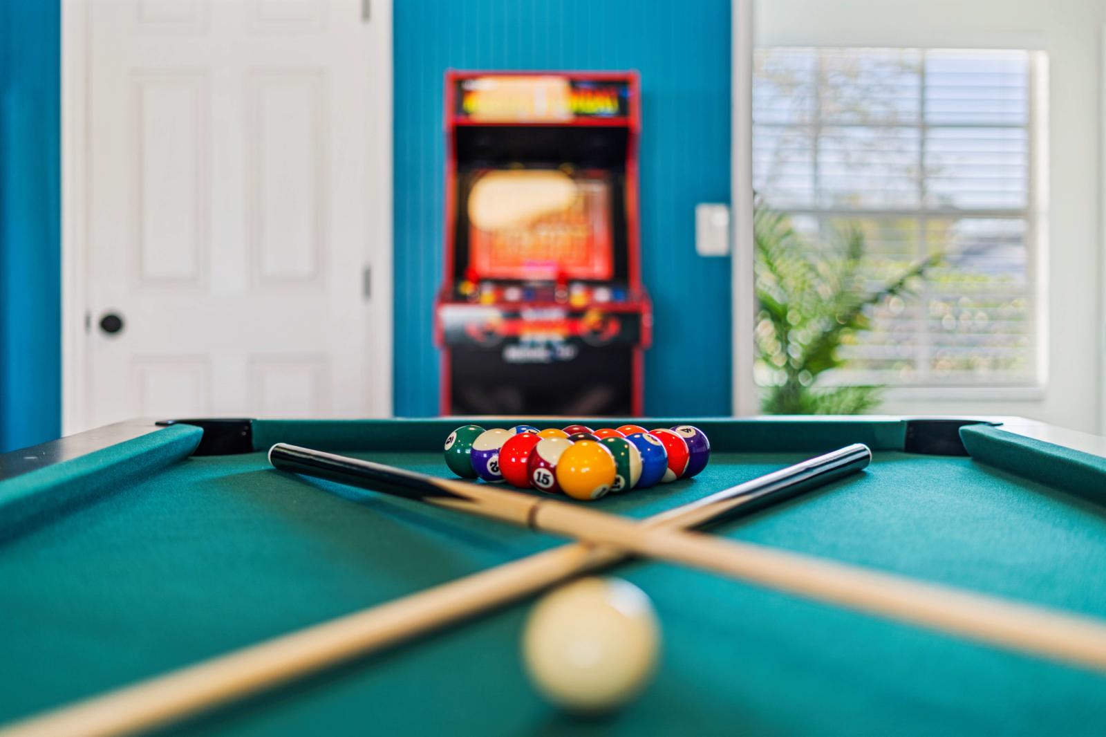 Game room featuring a snooker/pool table and a variety of exciting arcade games