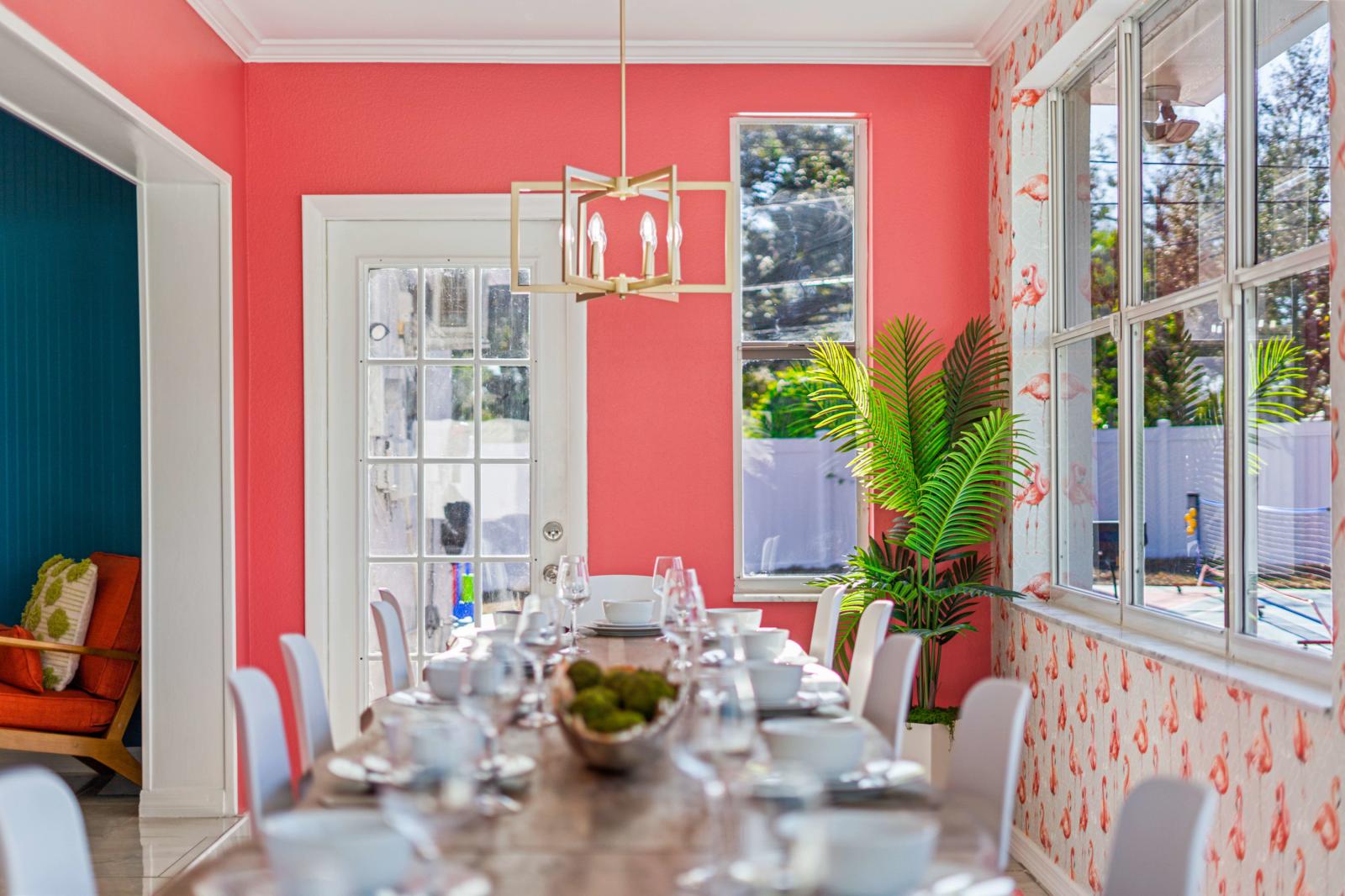 Spacious, sun-soaked dining room with picturesque views of the backyard.