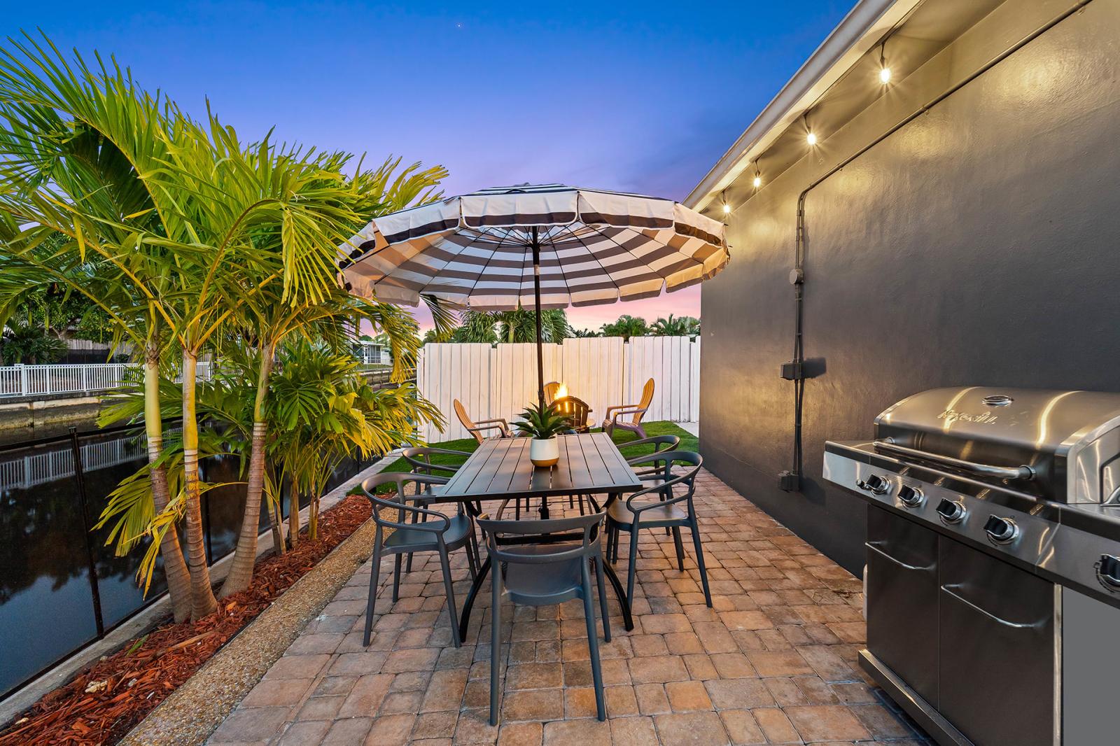 Grill and dine al fresco at the outdoor dining table.