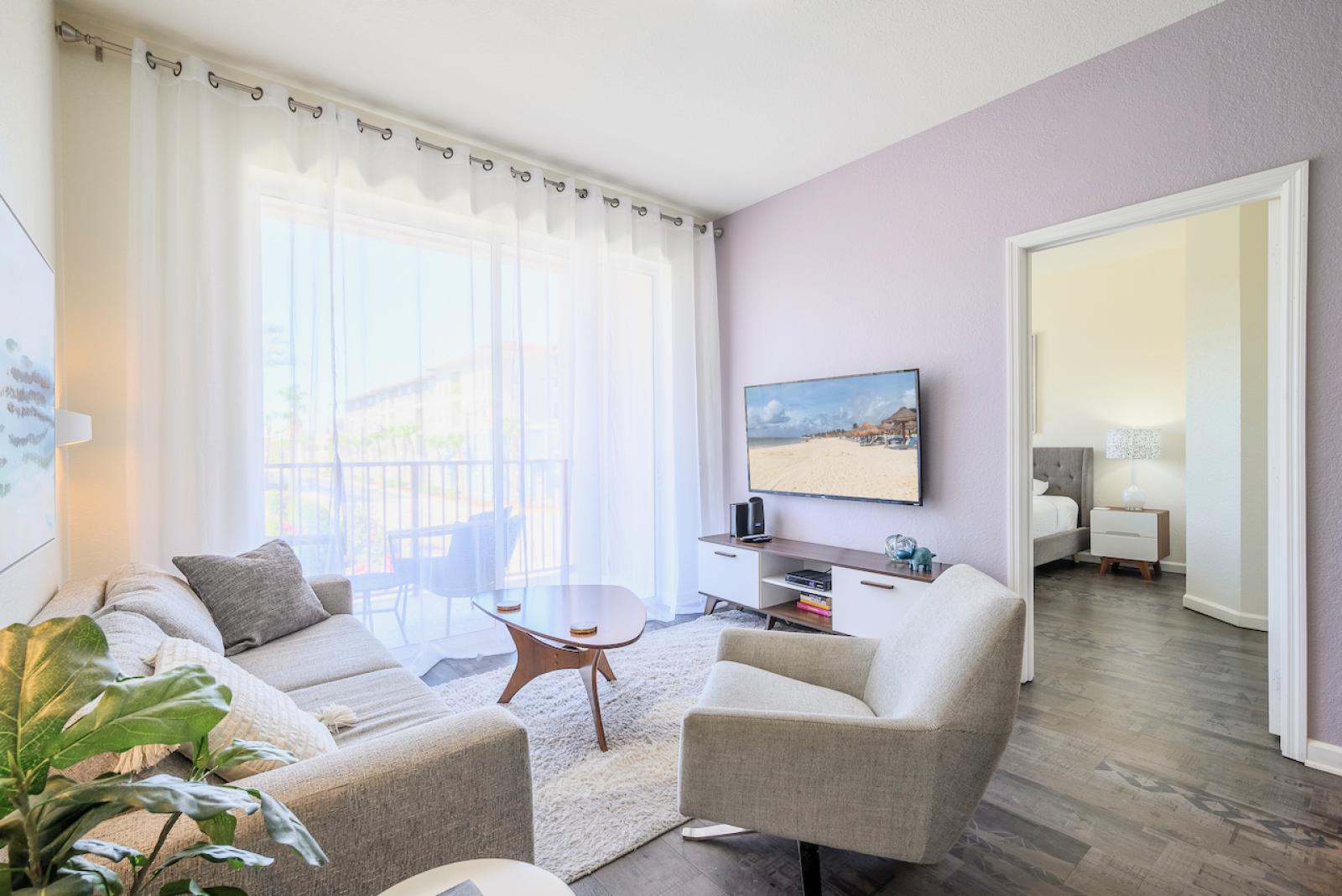 Living room with 55" smart TV overlooking the Vista Cay fountain