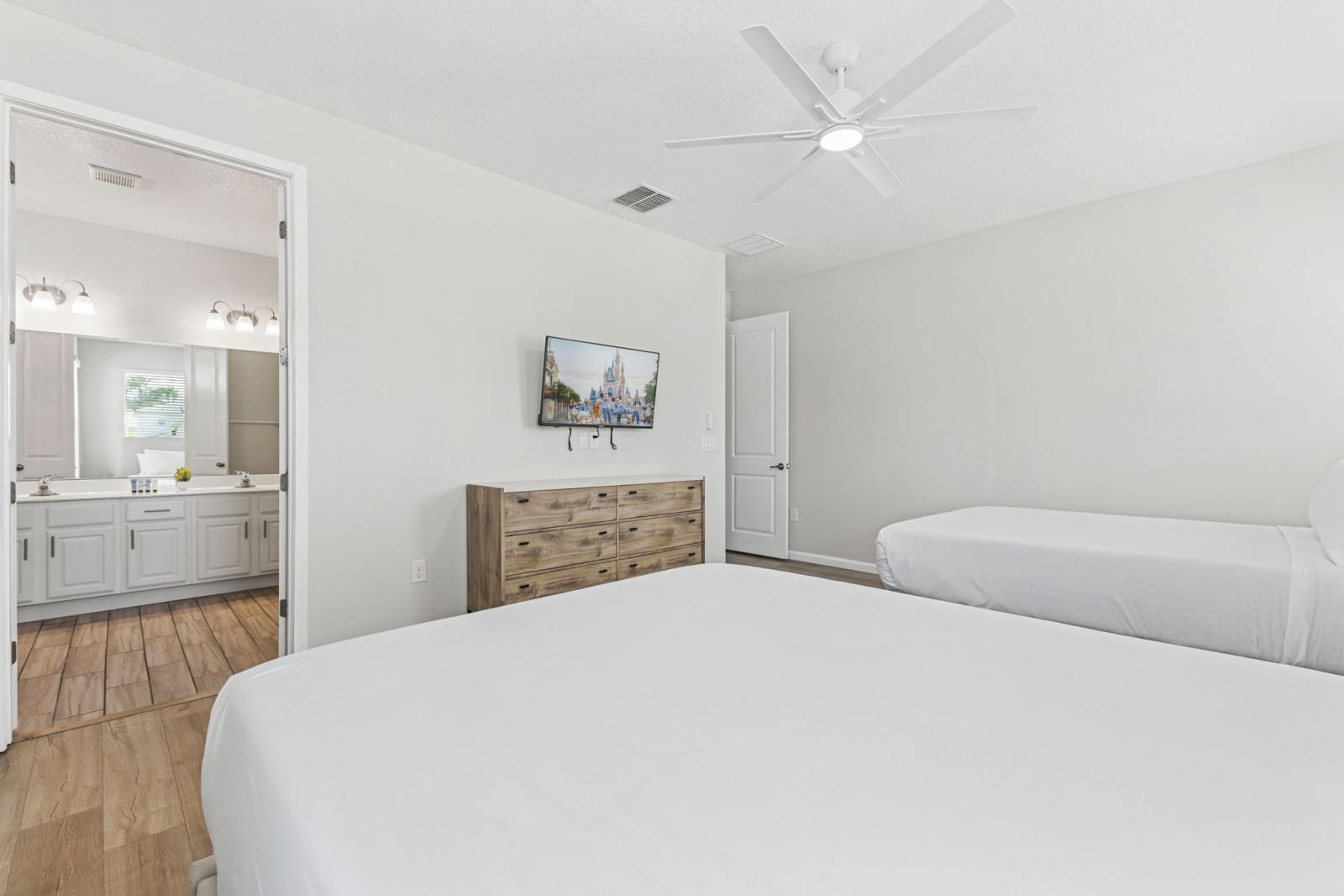 Bedroom 1 with 2 queen size beds and a private bathroom