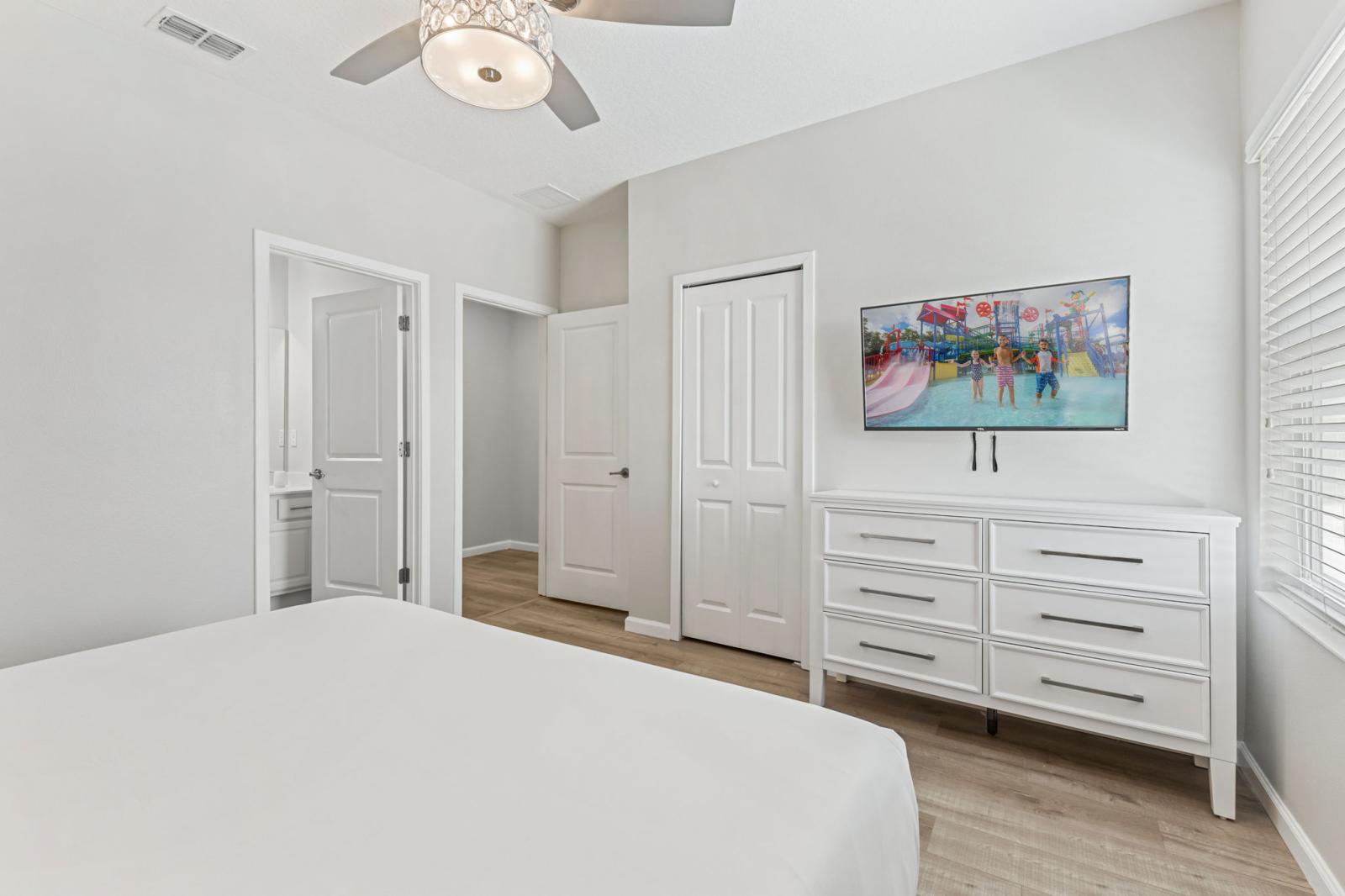 Bedroom 4 with a queen size bed and a private bathroom