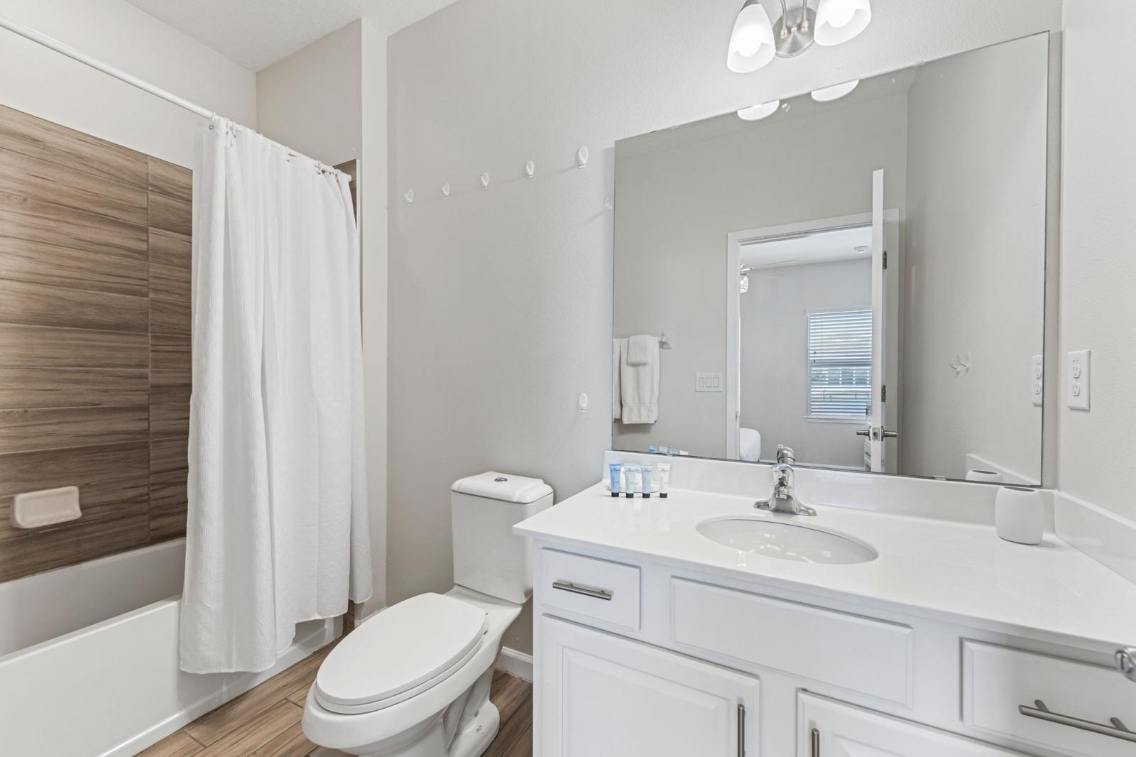 Bathroom 4 with a bathtub and a shower combo