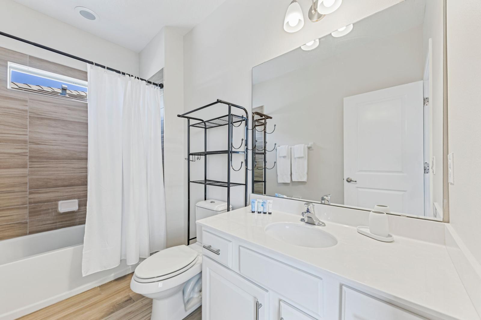 Bathroom 5 with a bathtub and a shower combo