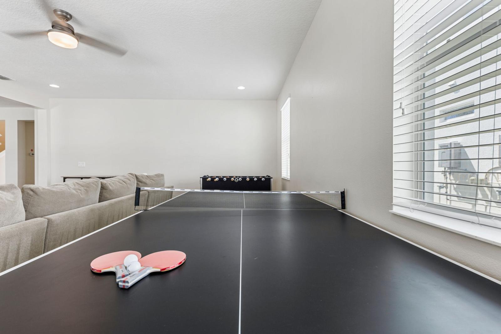 Entertainment area with foosball table and ping pong table