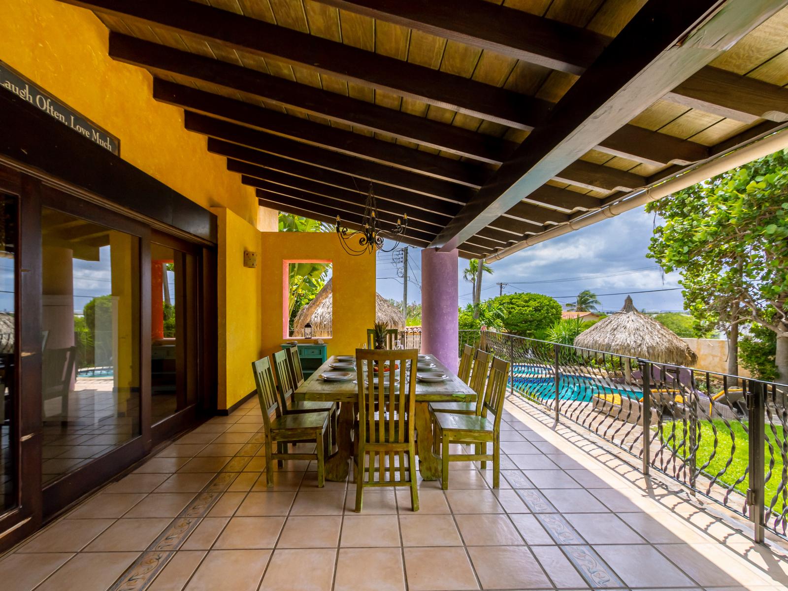 Glorious outdoor dinning area of the villa in Oranjestad Aruba - Beautiful pool facing outdoor dinning area of the villa - Elite 8 persons dinning - Mesmerizing pool views - Majestic decored space - Refreshing Environment