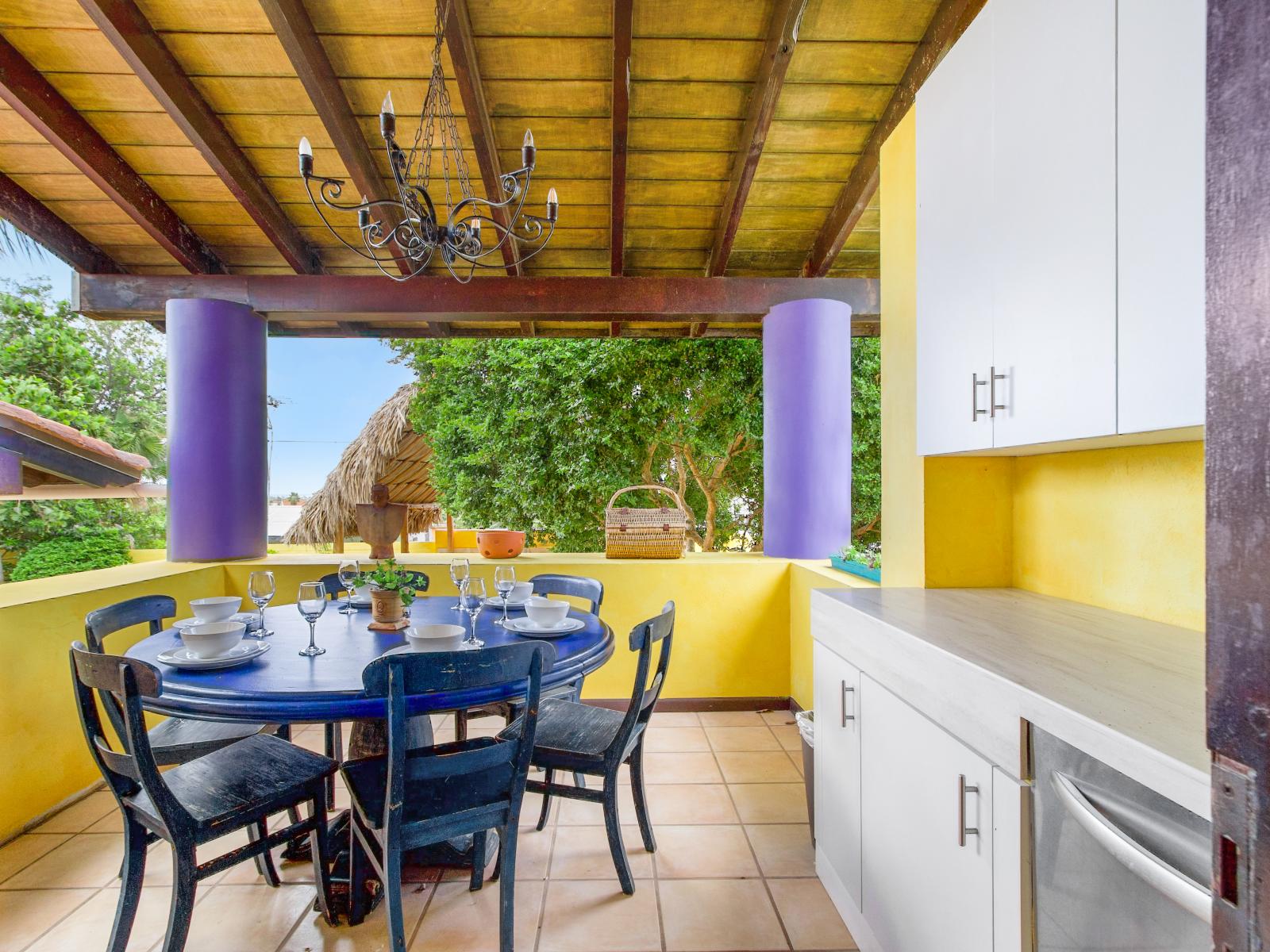 Kitchen has glass door to the outside dining table