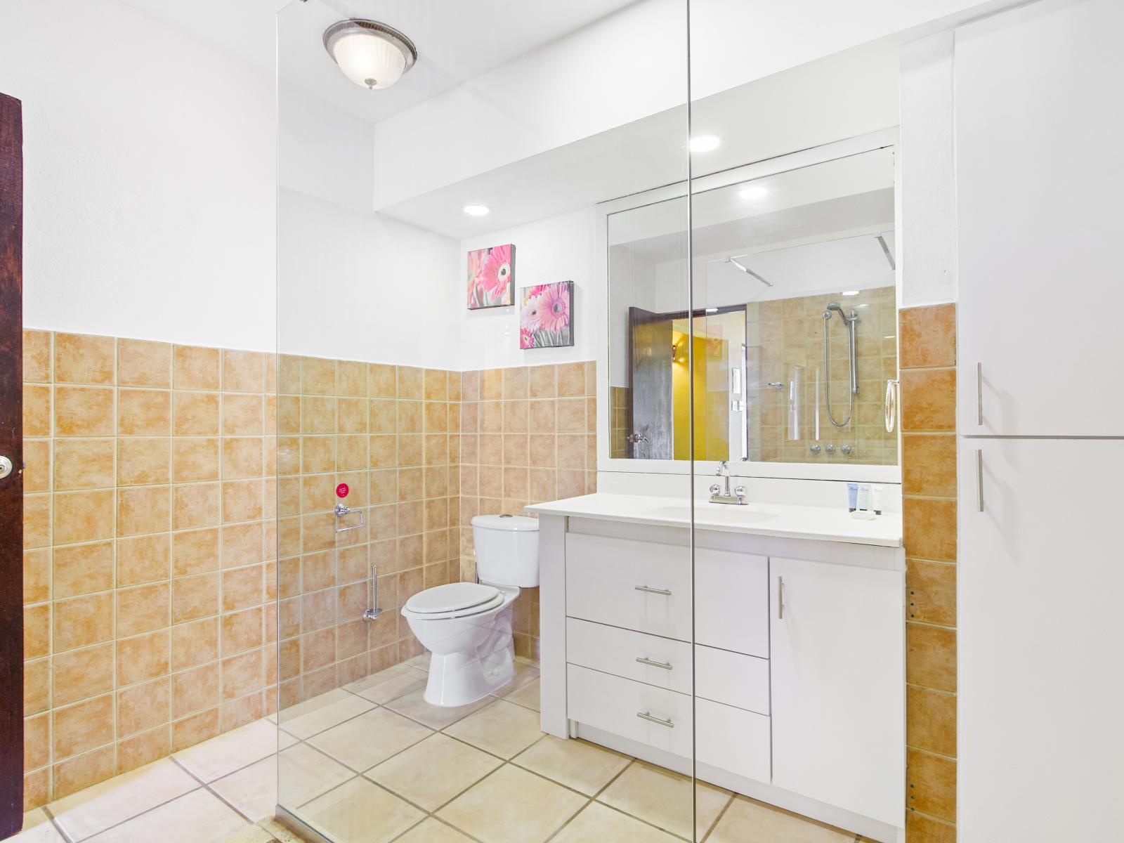 Indulge in comfort and convenience in the second bedroom's bathroom, boasting a modern walk-in shower.