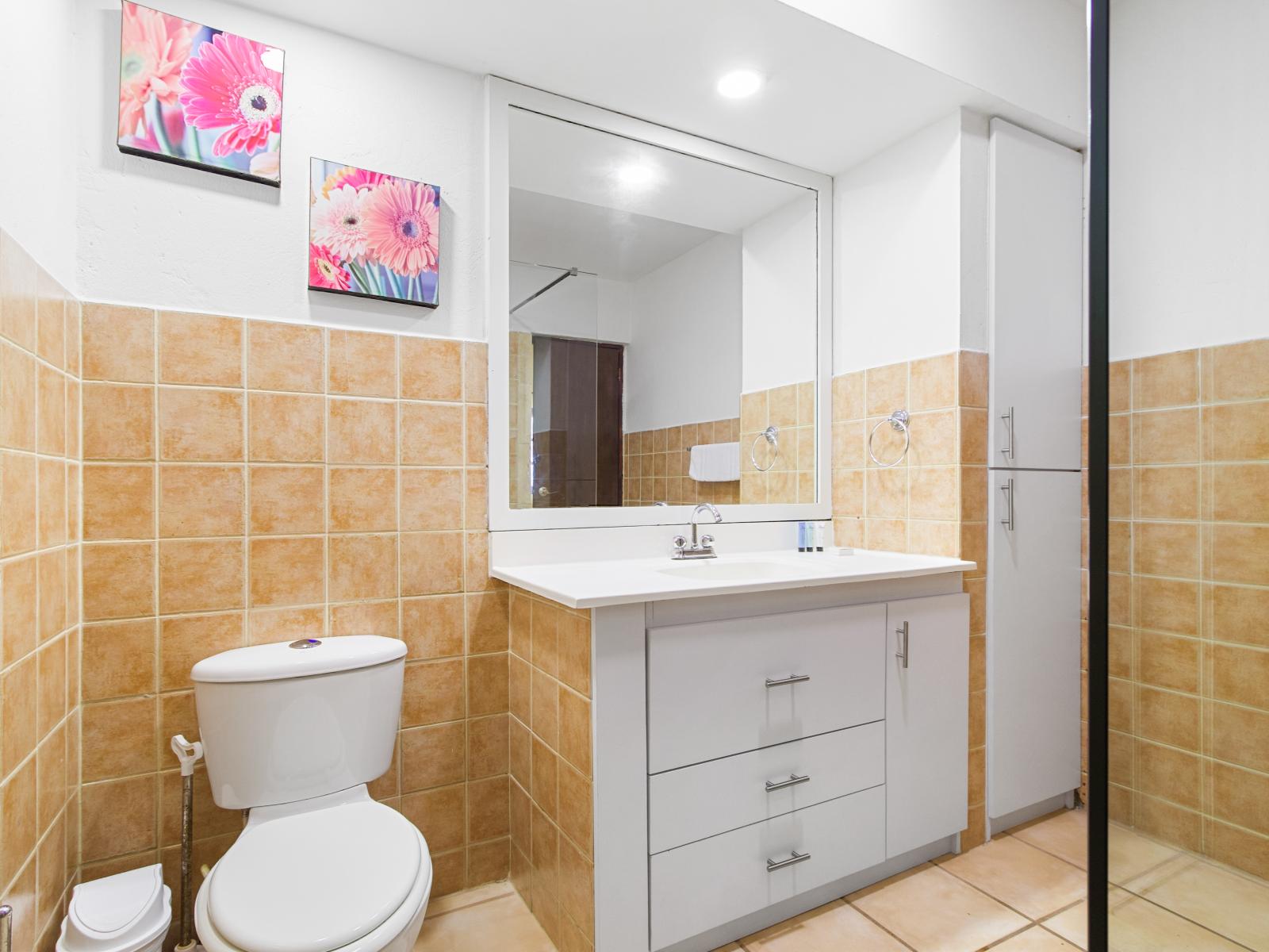 Indulge in comfort and convenience in the second bedroom's bathroom, boasting a modern walk-in shower.