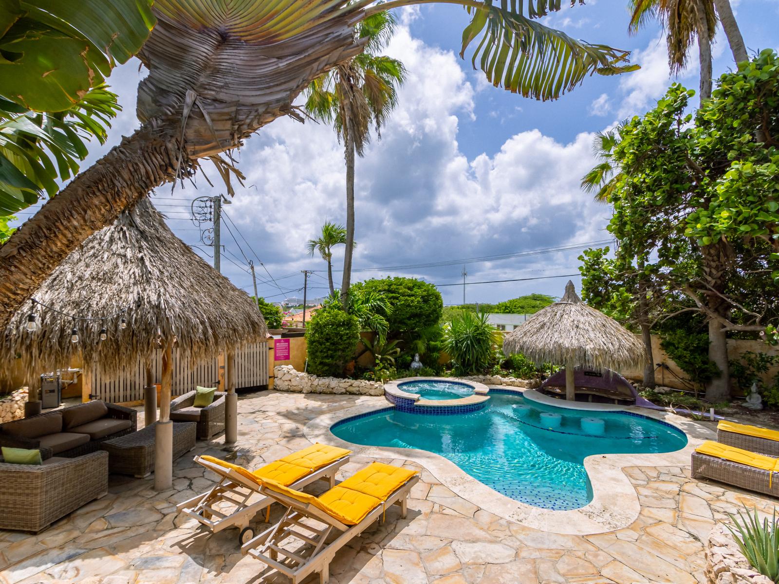 Escape to your own tropical oasis with our private pool and hot tub, perfect for ultimate relaxation