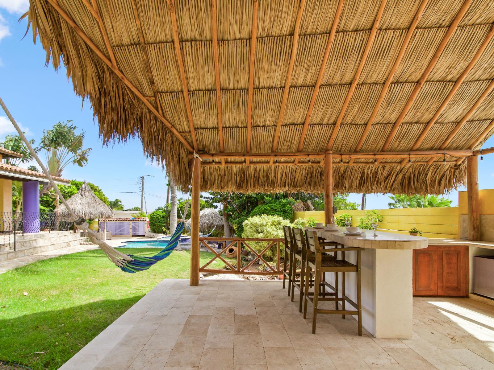 Tropical palapa bar with hammock