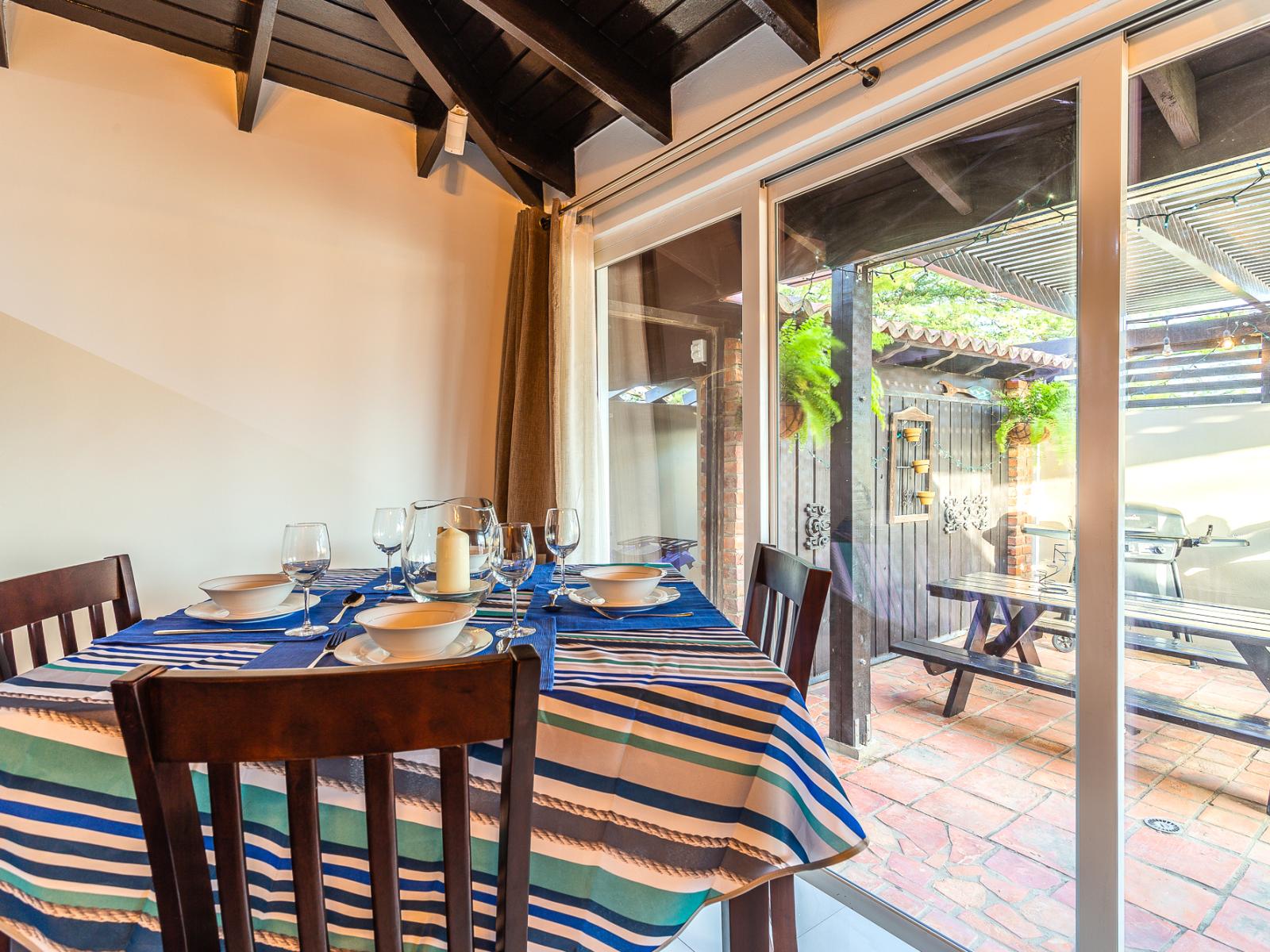 Lofty Dining Area of the Apartment in Noord Aruba - 4 Persons Dining - Artfully arranged table settings for a touch of elegance - Outside Views