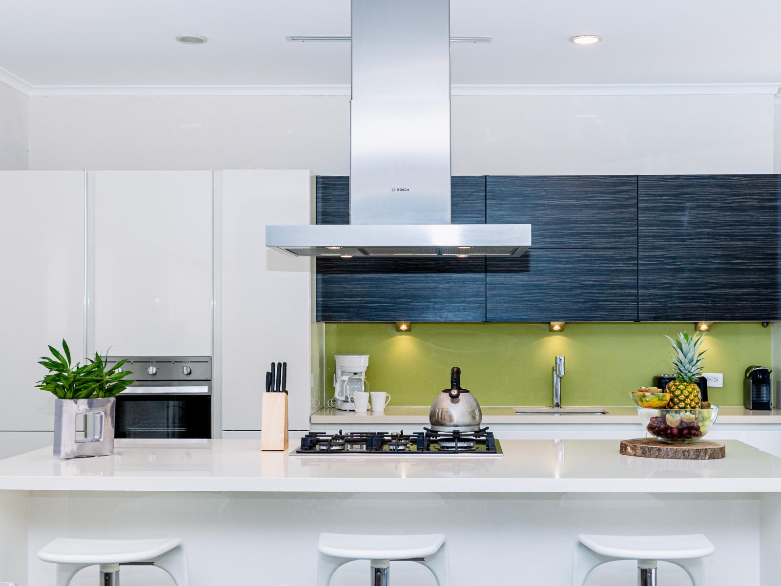 Opulent Kitchen of the villa in Noord Aruba - Breakfast Bar - Open concept connecting the kitchen to the dining - Appliance coordination for a polished and uniform appearance