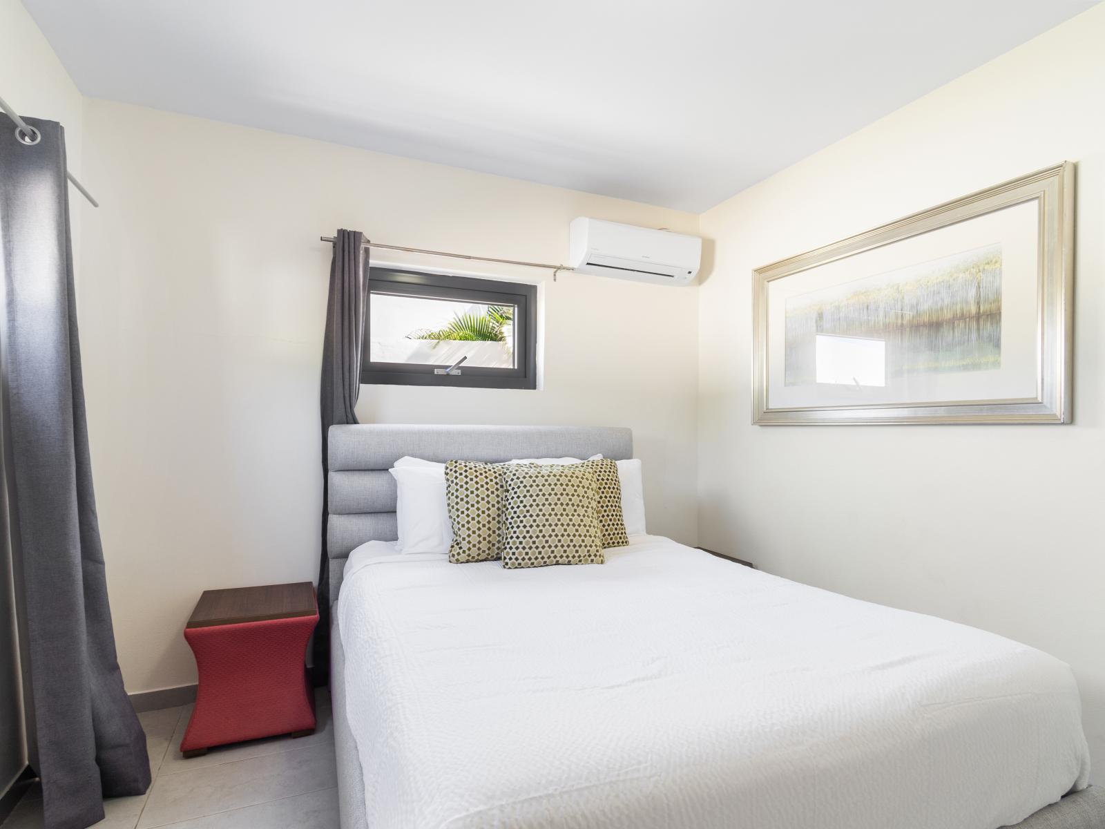 Enjoy Bedroom 6 with its queen-size bed and TV for added comfort and entertainment.