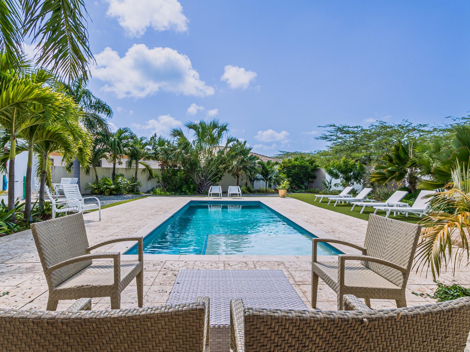 Savor the serenity: our swimming pool and sun lounges offer a secluded oasis for rest and relaxation.