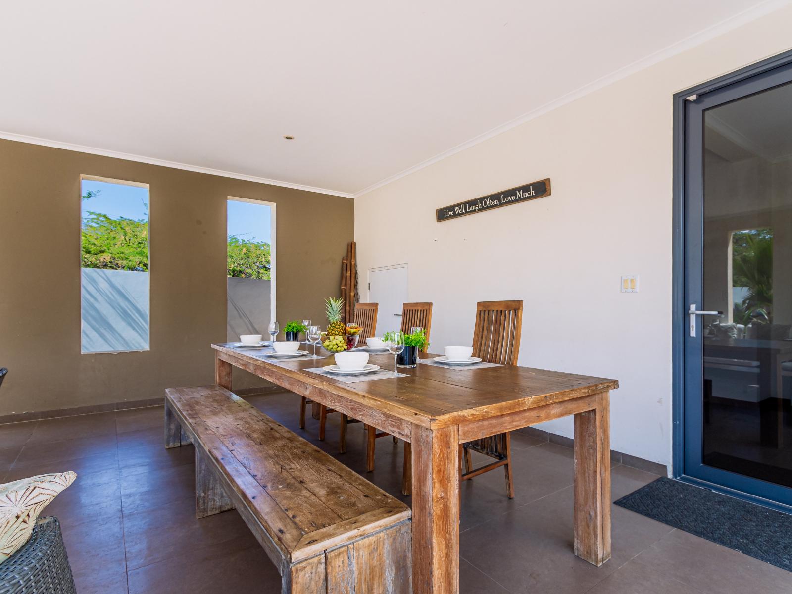 Dining table outside for enjoying meals by the pool