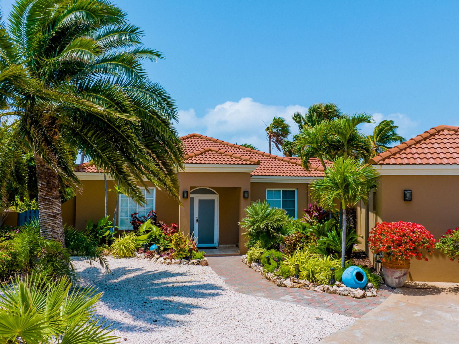 Step into the warm embrace of our inviting home entrance, where comfort meets style, setting the perfect tone for your stay.