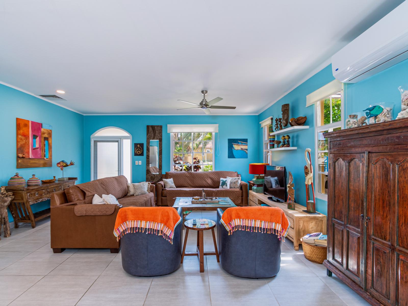 Living room with lots of seating options and a flat screen TV