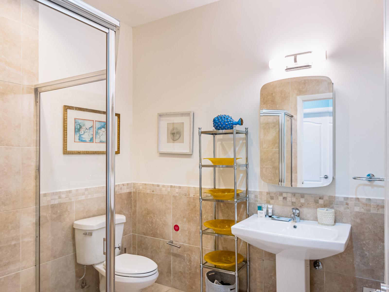 Bathroom 3 features a spacious walk-in shower, combining convenience and comfort for your stay.