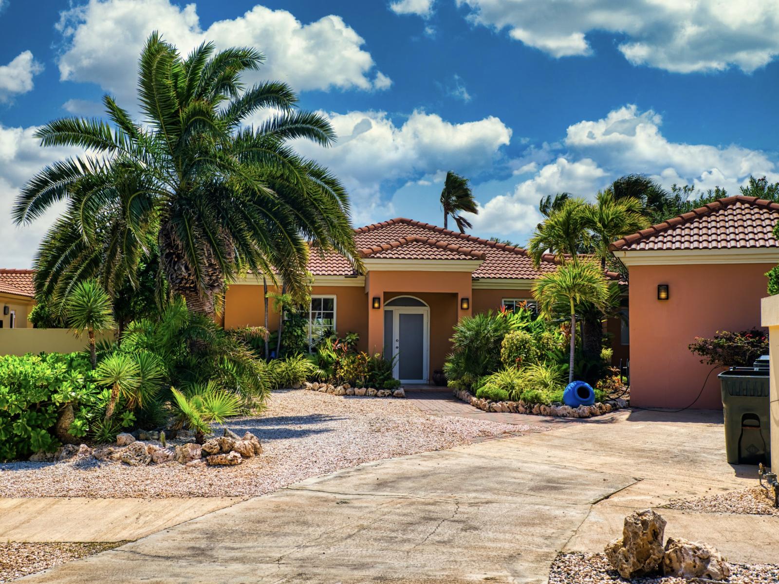 Front view of the villa, highlighting its welcoming charm and elegant design.