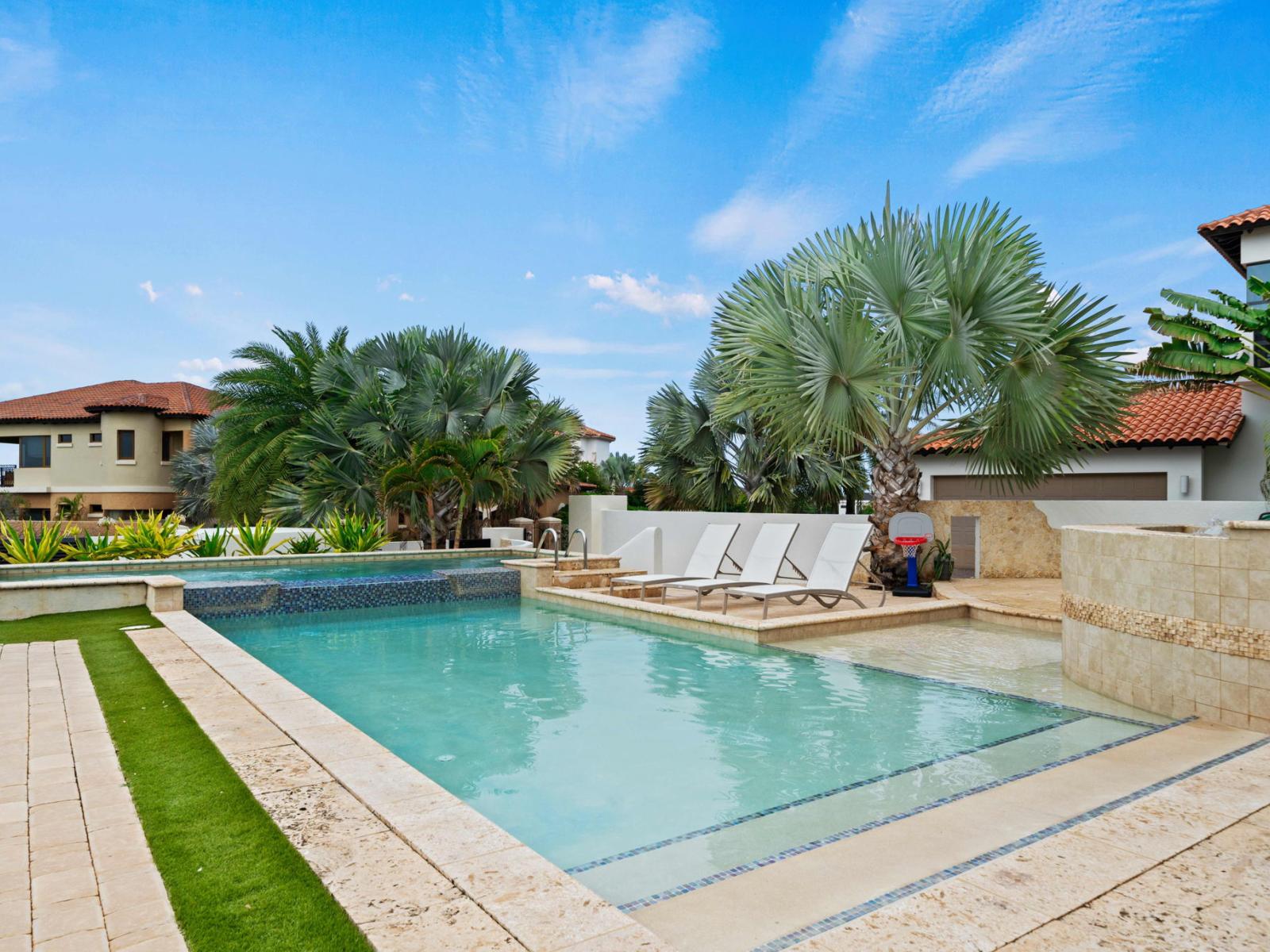 Villa with private pool and lounge chairs