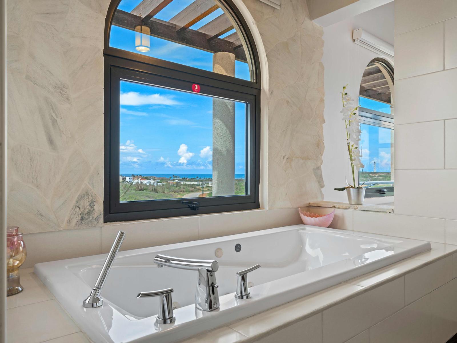 Bathroom 1 features a relaxing bath tub