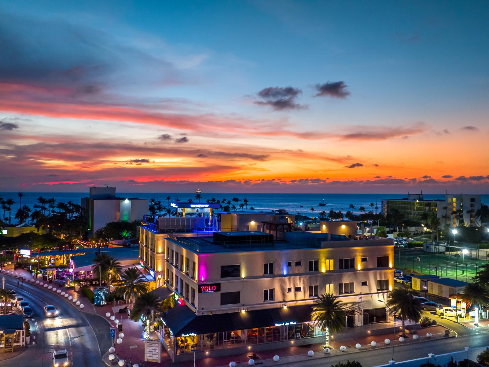 Witness nature's beauty unfold with sunset ocean views from our luxurious condo. - Indulge in breathtaking views of the sunset over the ocean from our living room. - Elevate your stay with unforgettable sunset vistas from our beachfront condo.