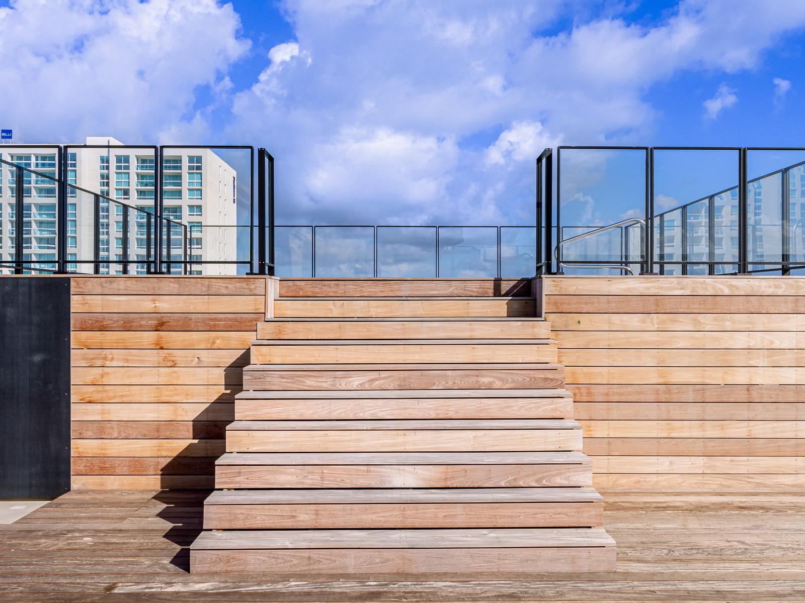 Rise above it all with our staircase leading to the rooftop pool experience. - Escape to serenity with each step towards our rooftop pool retreat. - Experience elevated relaxation with our staircase to the rooftop pool.