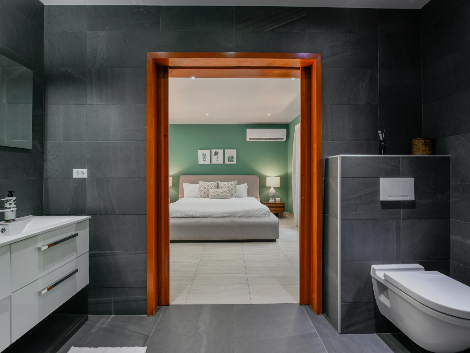 Enjoy the ultimate convenience with Bathroom 1 directly connected to Bedroom 1, ensuring privacy and ease during your stay.