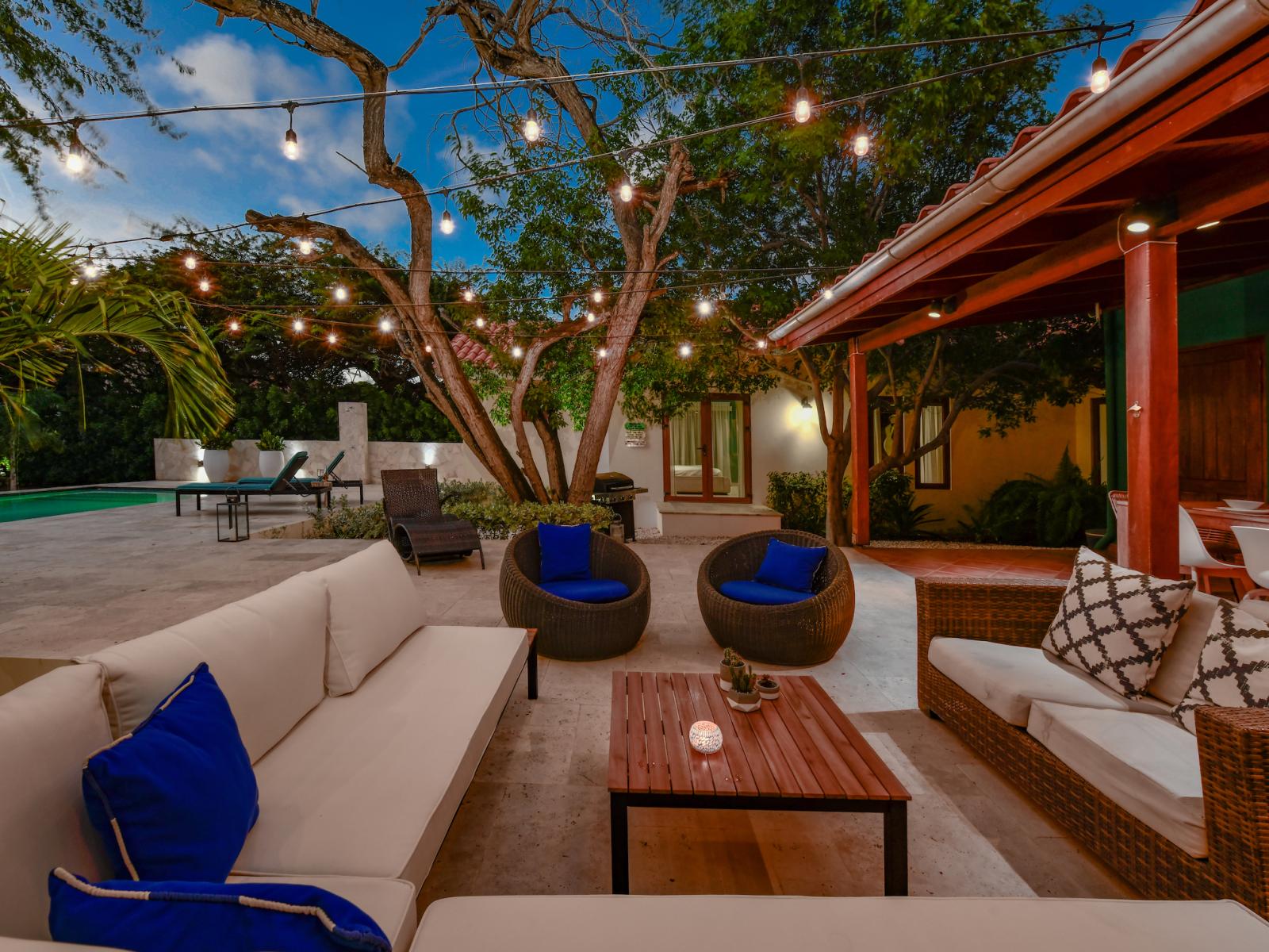 Elevate your outdoor experience with charming string lights, casting a warm and inviting glow that sets the perfect atmosphere for memorable gatherings and relaxation.