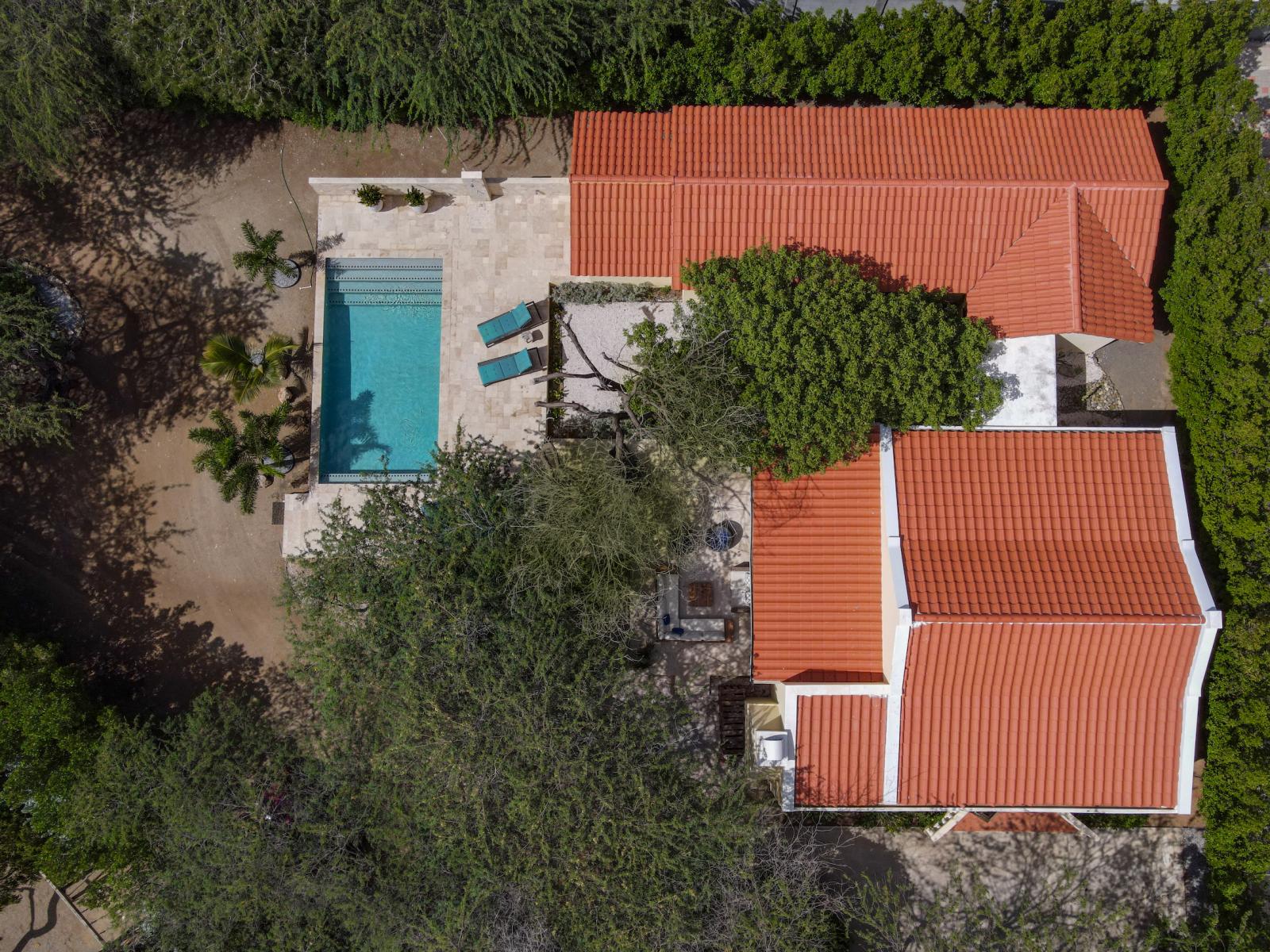 Experience the grandeur of our villa from above with a breathtaking drone shot, capturing the beauty and scale of this exquisite retreat.