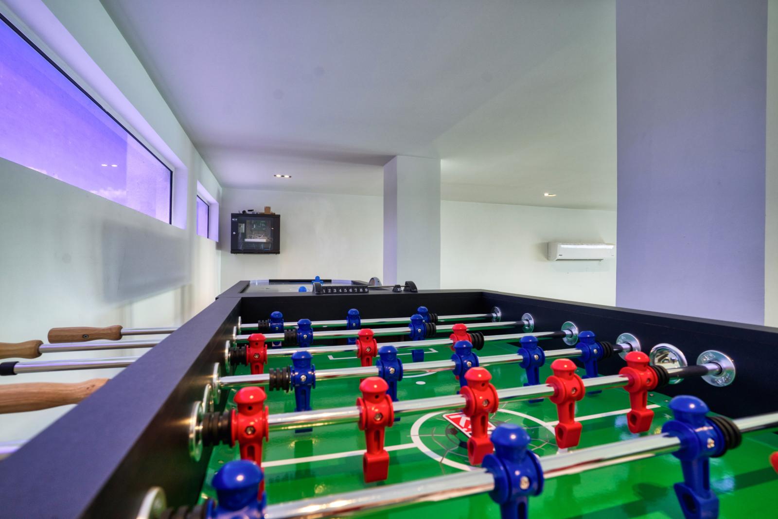 Unleash your competitive spirit in our game area featuring a thrilling foosball table – where laughter, camaraderie, and epic matches await!